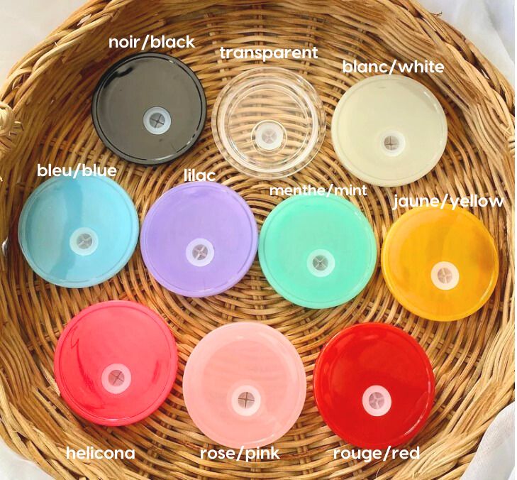 a wicker basket filled with lots of different colored discs